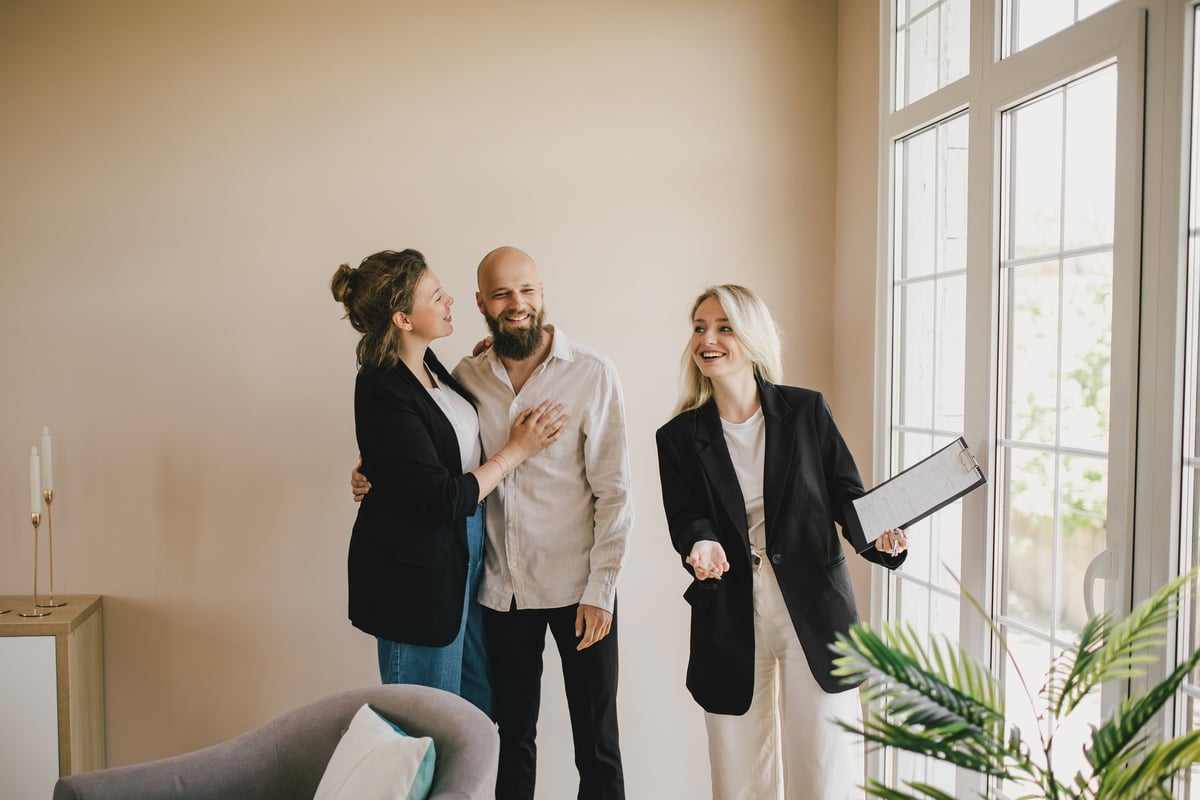 Real estate agent showing apartment to couple